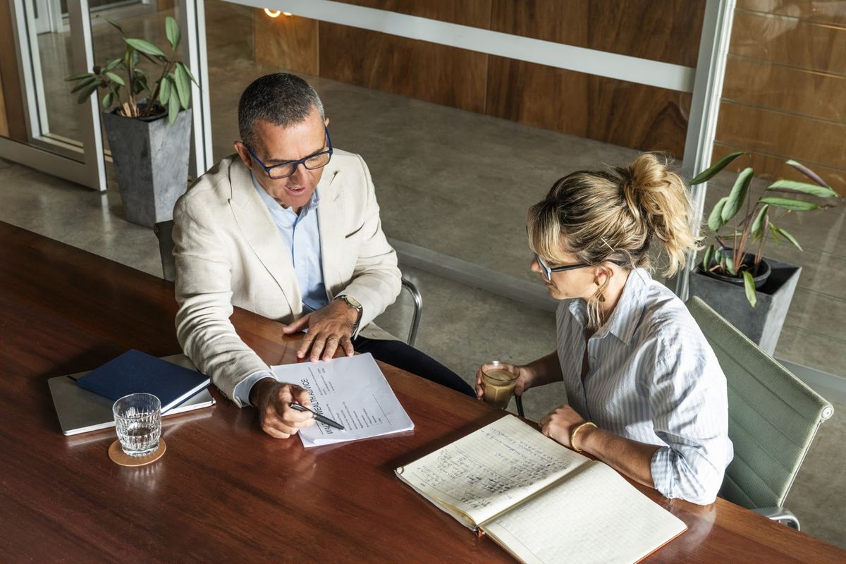 Nick Walter reviewing documents with a client